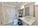 Clean bathroom featuring subway tile backsplash, bright lighting, and pedestal sink at 1100 Howell Mill Nw Rd # 312, Atlanta, GA 30318