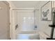 Cozy bathroom featuring subway tile backsplash, bright lighting, and decorative koala art at 1100 Howell Mill Nw Rd # 312, Atlanta, GA 30318