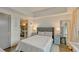 Well-lit bedroom with direct access to ensuite bathroom, large closet, and views of city through large window at 1100 Howell Mill Nw Rd # 312, Atlanta, GA 30318