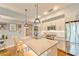 Bright kitchen with quartz countertops, stainless steel appliances, and island with bar stool seating at 1100 Howell Mill Nw Rd # 312, Atlanta, GA 30318