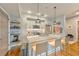 Modern kitchen featuring stainless steel appliances, an island with bar seating, and floating shelves at 1100 Howell Mill Nw Rd # 312, Atlanta, GA 30318