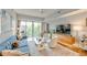 Open living room with hardwood floors, contemporary furniture, and a sliding glass door to a balcony at 1100 Howell Mill Nw Rd # 312, Atlanta, GA 30318