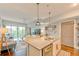 Open concept living room and kitchen area featuring hardwood floors and modern decor at 1100 Howell Mill Nw Rd # 312, Atlanta, GA 30318