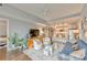 Bright and open living room showcasing modern decor, hardwood floors, and seamless flow to the kitchen at 1100 Howell Mill Nw Rd # 312, Atlanta, GA 30318