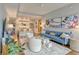 Bright living room with hardwood floors, modern decor, and an open floor plan flowing into the kitchen at 1100 Howell Mill Nw Rd # 312, Atlanta, GA 30318
