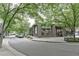 A tree-lined street view showcasing the neighborhood's vibrant atmosphere at 1100 Howell Mill Nw Rd # 312, Atlanta, GA 30318