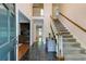 Inviting foyer with slate flooring, staircase, and view to the living spaces at 1404 Vernon North Dr, Dunwoody, GA 30338