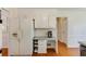 Kitchen featuring white appliances and wood flooring at 1404 Vernon North Dr, Dunwoody, GA 30338