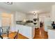 Bright kitchen with white cabinets, modern appliances, a breakfast nook, and hardwood flooring at 1404 Vernon North Dr, Dunwoody, GA 30338