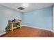View of a finished basement area featuring laminated wood flooring at 239 Berry Rd, Mcdonough, GA 30252