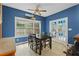 Dining area with wood floors, dining table, and view of the back yard at 239 Berry Rd, Mcdonough, GA 30252