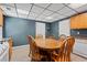 Open concept dining area with a wooden table set and views of the kitchen at 239 Berry Rd, Mcdonough, GA 30252