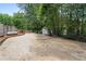 Wide driveway area offering plenty of parking space leading to the shed and backyard at 239 Berry Rd, Mcdonough, GA 30252