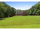 Charming two-story home with a large front yard and inviting curb appeal at 239 Berry Rd, Mcdonough, GA 30252
