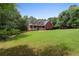 Beautiful home with a large lawn, front porch, and traditional design at 239 Berry Rd, Mcdonough, GA 30252