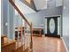 Foyer with a wooden staircase, elegant front door, and hardwood floors at 239 Berry Rd, Mcdonough, GA 30252