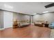 A very spacious living room with plenty of seating, lighting and wood floors at 239 Berry Rd, Mcdonough, GA 30252