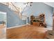 Open living room with a staircase, hardwood floors, and fireplace feature at 239 Berry Rd, Mcdonough, GA 30252