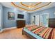 Spacious main bedroom with a ceiling fan, TV, walk-in closet, and wood flooring at 239 Berry Rd, Mcdonough, GA 30252
