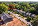 An aerial view showing the path entrance to a neighborhood street of single Gathering homes at 278 1St Ave, Avondale Estates, GA 30002