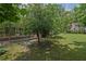 A large tree enhances the natural beauty of the yard and offers plenty of shade at 648 Cativo Sw Dr, Atlanta, GA 30311