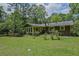 Well-maintained backyard and lush greenery offer a peaceful retreat at 648 Cativo Sw Dr, Atlanta, GA 30311