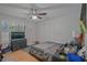Bedroom with ceiling fan, shuttered window, and closet at 648 Cativo Sw Dr, Atlanta, GA 30311