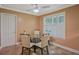Cozy dining area featuring a glass top table, neutral color scheme and shuttered window at 648 Cativo Sw Dr, Atlanta, GA 30311