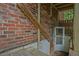 A small door and makeshift ramp on a brick wall lead into this home at 648 Cativo Sw Dr, Atlanta, GA 30311