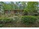 Charming brick home with a mix of stone accents and lush greenery at 648 Cativo Sw Dr, Atlanta, GA 30311