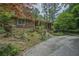 Charming brick home with a long driveway and unique landscaping creating great curb appeal at 648 Cativo Sw Dr, Atlanta, GA 30311