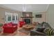 Comfortable living room with a stone fireplace, hardwood floors, and neutral tones at 648 Cativo Sw Dr, Atlanta, GA 30311