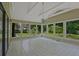 Bright sunroom with large windows offering lush backyard views and a neutral color palette to match any style at 648 Cativo Sw Dr, Atlanta, GA 30311