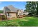 Spacious backyard features a wooden deck, green lawn, and privacy fence at 1377 Downington Nw Ln, Acworth, GA 30101