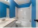 Bright bathroom featuring a tub, toilet, and sink with a mirror at 1377 Downington Nw Ln, Acworth, GA 30101