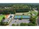 Aerial view of community amenities featuring a pool, playground, and tennis courts at 1377 Downington Nw Ln, Acworth, GA 30101