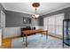 Elegant dining room with hardwood floors, wainscoting, and decorative chandelier at 1377 Downington Nw Ln, Acworth, GA 30101