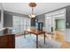 Elegant dining room with hardwood floors, wainscoting, and decorative chandelier at 1377 Downington Nw Ln, Acworth, GA 30101