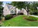 Stunning two-story home with manicured lawn, mature trees, and attached two-car garage at 1377 Downington Nw Ln, Acworth, GA 30101