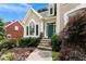 Inviting front entrance with stone steps, decorative door, and professionally landscaped garden at 1377 Downington Nw Ln, Acworth, GA 30101