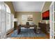 Bright home office with hardwood floors, vaulted ceilings, and a stylish desk with decor at 1377 Downington Nw Ln, Acworth, GA 30101