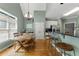 Eat-in kitchen with vaulted ceiling, dining table, bar seating and light green walls at 1377 Downington Nw Ln, Acworth, GA 30101
