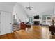 Expansive living room with vaulted ceiling, fireplace, hardwood floors, and natural light at 1377 Downington Nw Ln, Acworth, GA 30101