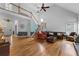 Spacious living room with hardwood floors, fireplace, vaulted ceilings, and stairs to upper level at 1377 Downington Nw Ln, Acworth, GA 30101