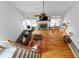 Open-concept living room with hardwood floors, fireplace, and plenty of light at 1377 Downington Nw Ln, Acworth, GA 30101