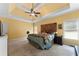 Main bedroom features tray ceiling, large windows, and carpeted floors at 1377 Downington Nw Ln, Acworth, GA 30101