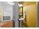 Stylish powder room with pedestal sink, decorative mirror, and painted walls at 1377 Downington Nw Ln, Acworth, GA 30101