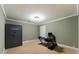 Room with a secure Cabela's safe and a desk setup, perfect for a home office or secure storage at 1377 Downington Nw Ln, Acworth, GA 30101