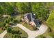 A beautiful home surrounded by lush greenery, with a long driveway at 1750 Providence Place Dr, Alpharetta, GA 30009