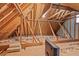 Exposed attic space showing unfinished floor and roof and wall studs at 1750 Providence Place Dr, Alpharetta, GA 30009